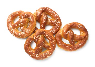 Photo of Tasty pretzels with salt isolated on white, top view
