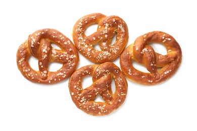 Photo of Tasty pretzels with salt isolated on white, top view