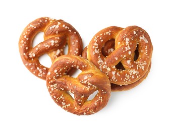 Photo of Tasty pretzels with salt isolated on white, top view
