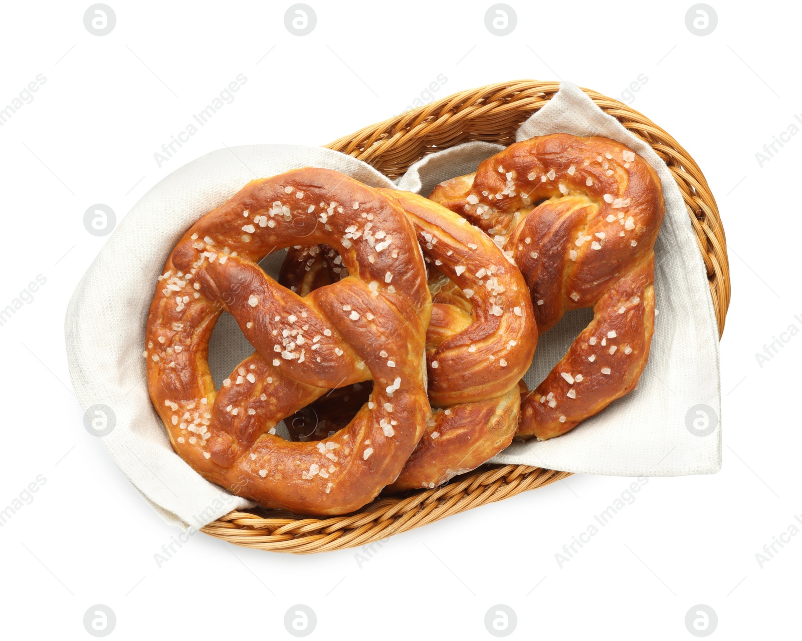 Tasty pretzels with salt in wicker basket isolated on white, top view Photo of Tasty pretzels with salt in wicker basket isolated on white, top view