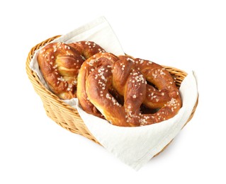 Photo of Tasty pretzels with salt in wicker basket isolated on white