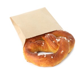 Photo of Tasty pretzel with salt in paper package isolated on white