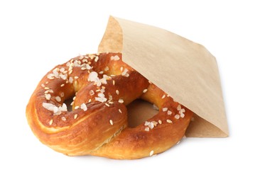 Photo of Tasty pretzel with salt in paper package isolated on white