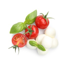 Photo of Tasty mozzarella cheese balls, tomatoes and basil isolated on white, top view