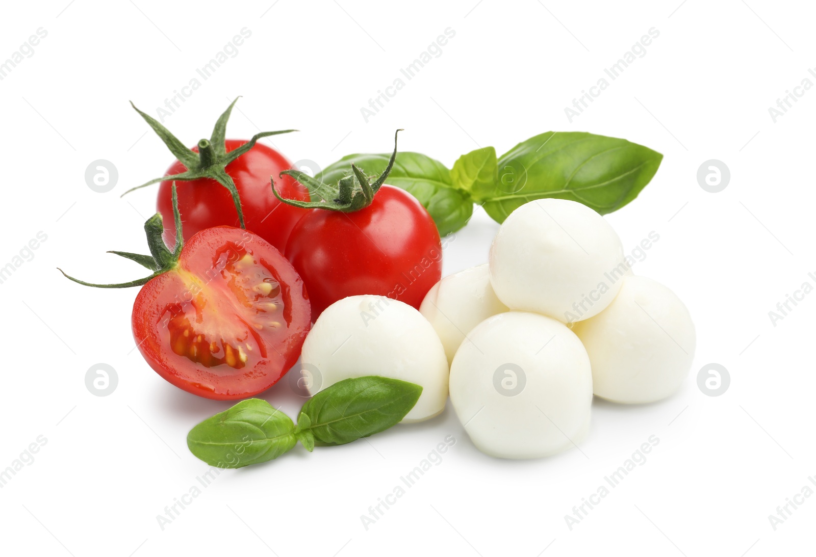 Tasty mozzarella cheese balls, tomatoes and basil isolated on white Photo of Tasty mozzarella cheese balls, tomatoes and basil isolated on white