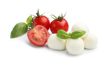 Photo of Tasty mozzarella cheese balls, tomatoes and basil isolated on white