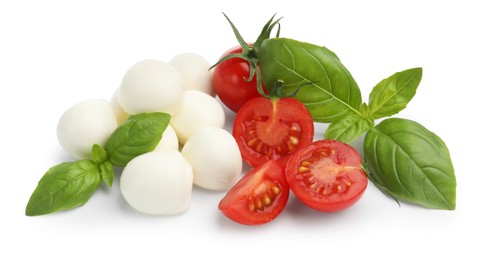 Photo of Tasty mozzarella cheese balls, tomatoes and basil isolated on white, above view