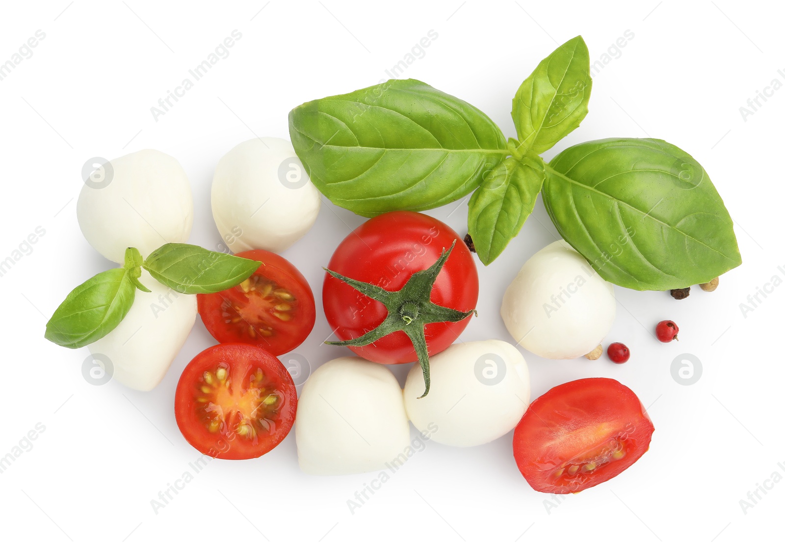 Tasty mozzarella cheese balls, tomatoes, peppercorns and basil isolated on white, top view Photo of Tasty mozzarella cheese balls, tomatoes, peppercorns and basil isolated on white, top view