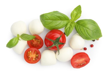 Photo of Tasty mozzarella cheese balls, tomatoes, peppercorns and basil isolated on white, top view