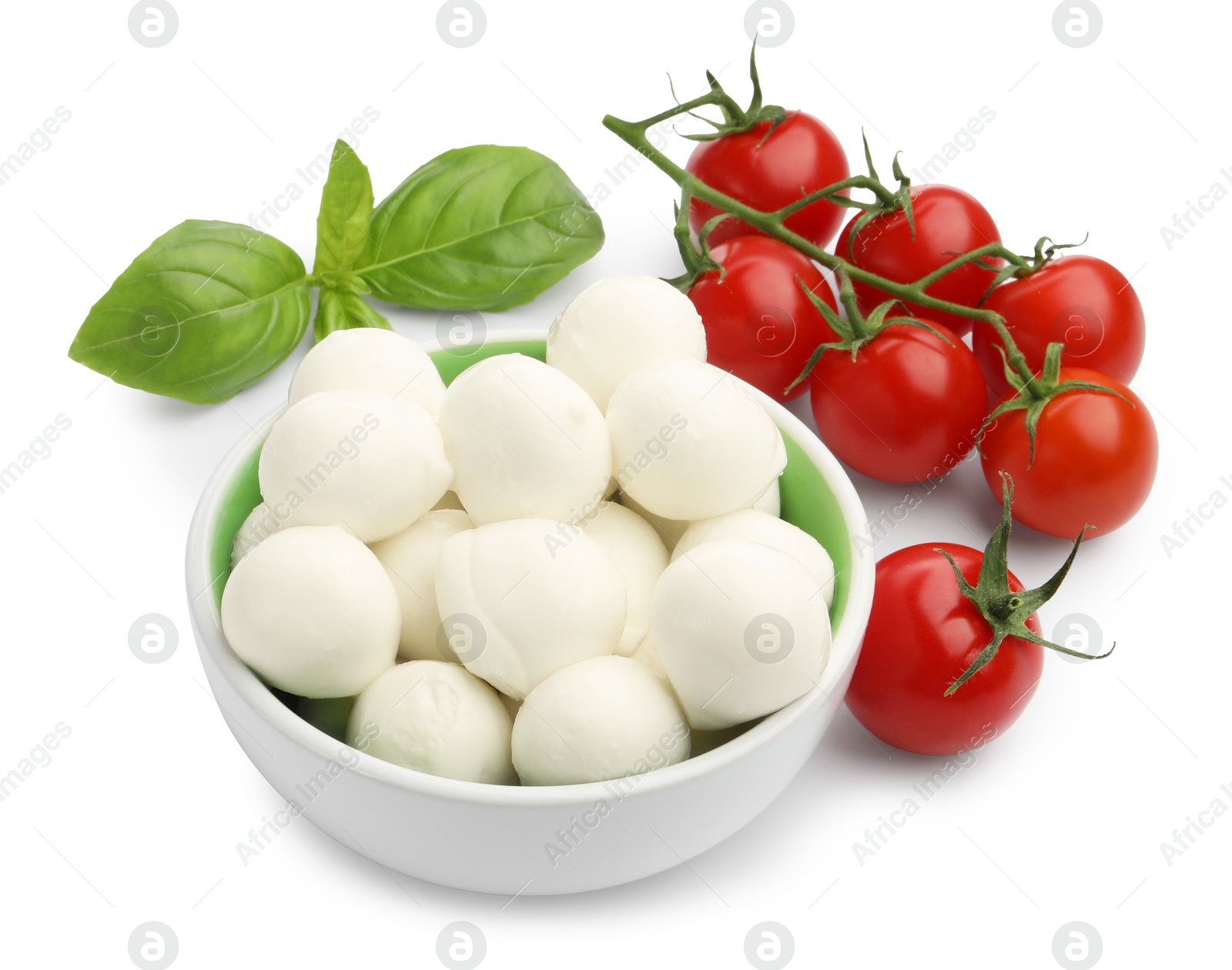 Tasty mozzarella cheese balls, tomatoes and basil isolated on white Photo of Tasty mozzarella cheese balls, tomatoes and basil isolated on white