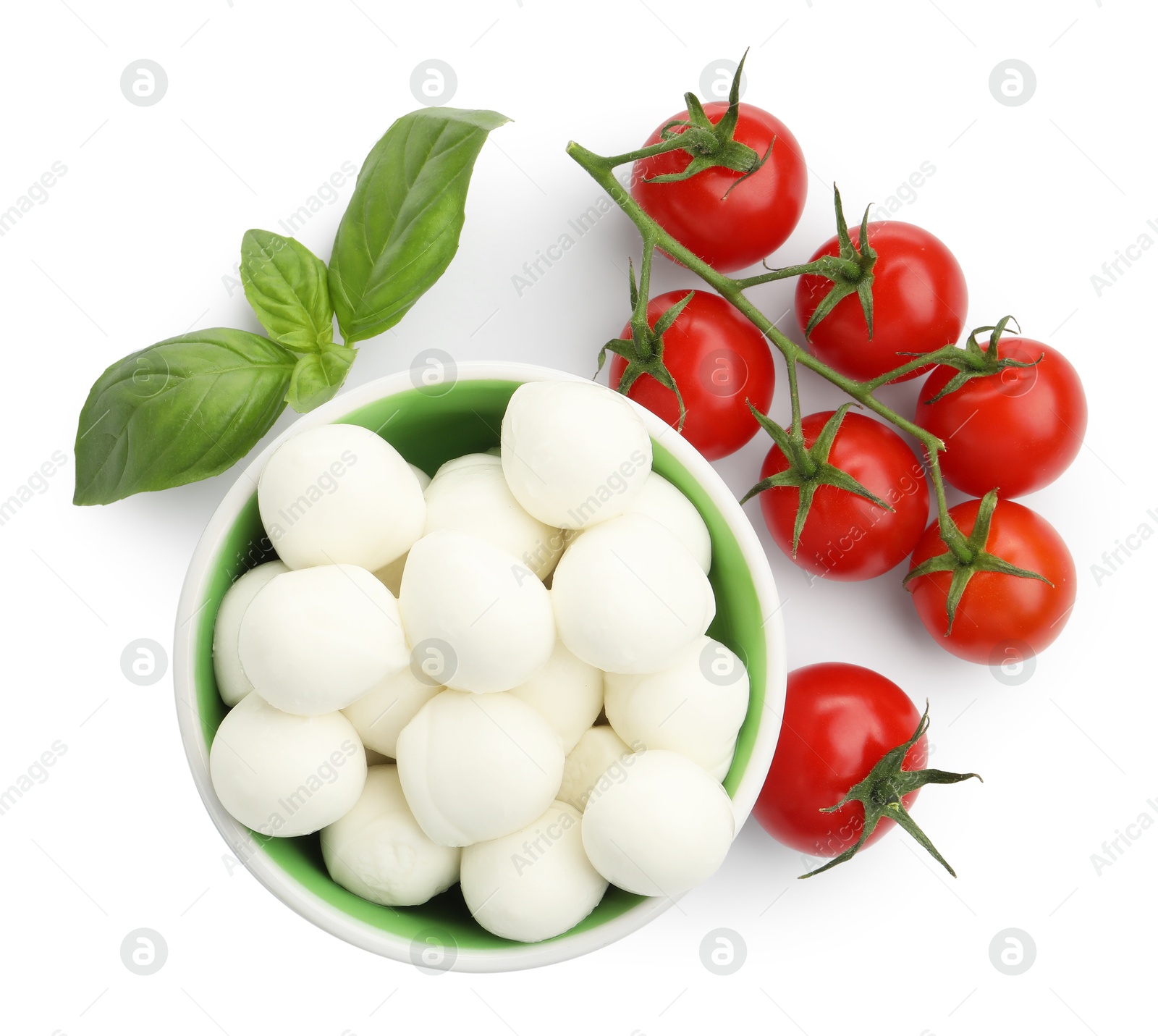 Tasty mozzarella cheese balls, tomatoes and basil isolated on white, top view Photo of Tasty mozzarella cheese balls, tomatoes and basil isolated on white, top view