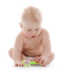 Photo of Cute little baby with rattle on white background