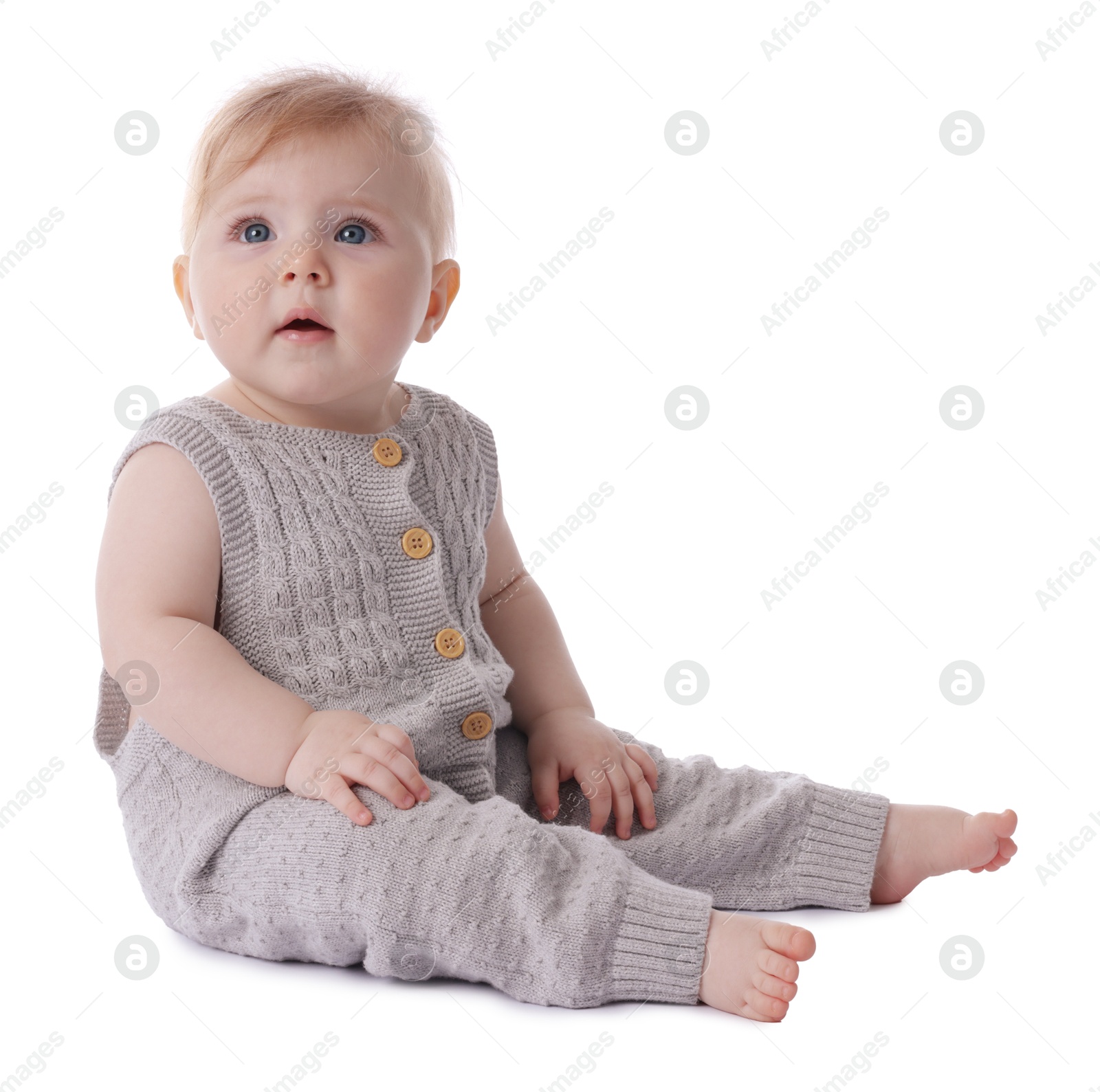 Cute little baby in knitted romper on white background Photo of Cute little baby in knitted romper on white background