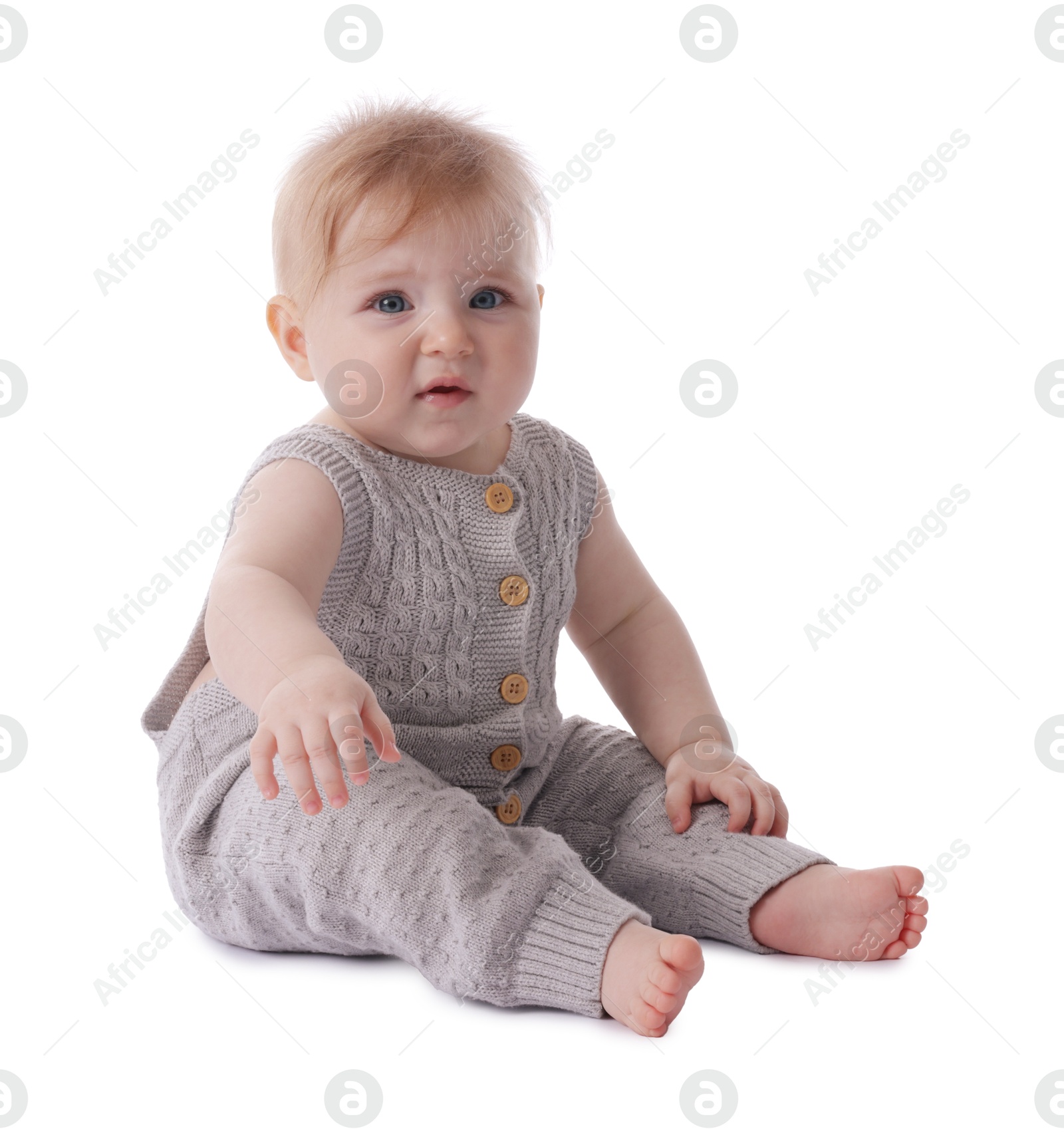 Cute little baby in knitted romper on white background Photo of Cute little baby in knitted romper on white background