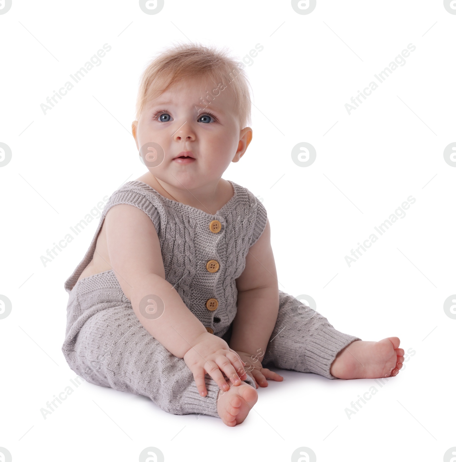 Cute little baby in knitted romper on white background Photo of Cute little baby in knitted romper on white background