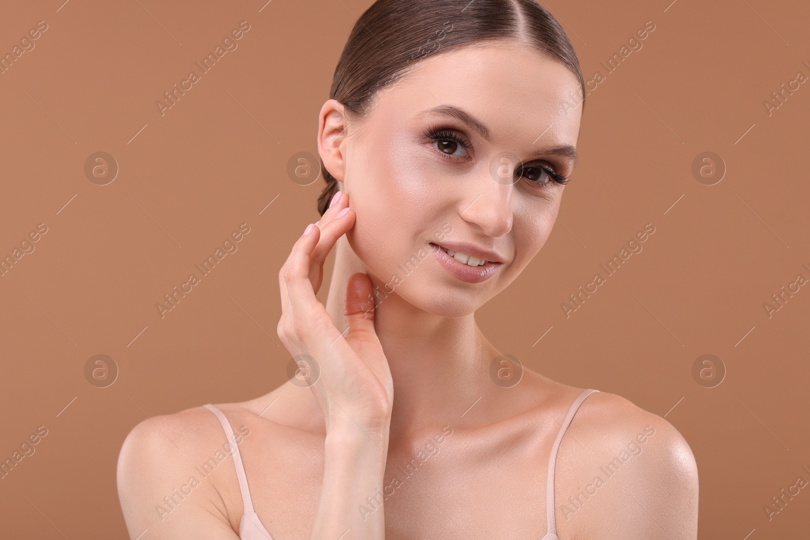 Portrait of beautiful young woman on beige background Photo of Portrait of beautiful young woman on beige background