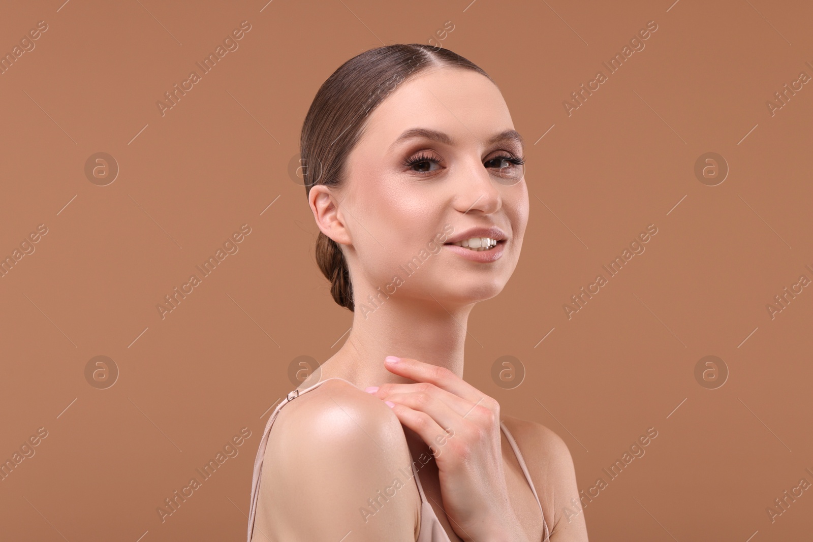 Portrait of beautiful young woman on beige background Photo of Portrait of beautiful young woman on beige background
