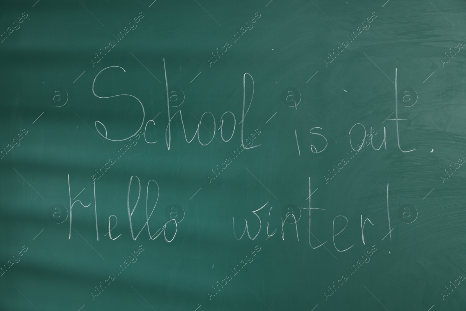 Phrases School Is Out and Hello Winter with exclamation mark on blackboard Photo of Phrases School Is Out and Hello Winter with exclamation mark on blackboard