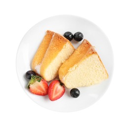 Photo of Pieces of tasty bundt cake with berries isolated on white, top view