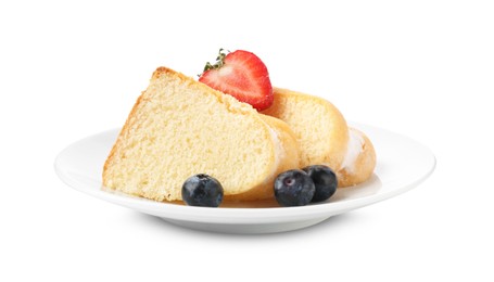 Photo of Pieces of tasty bundt cake with berries isolated on white