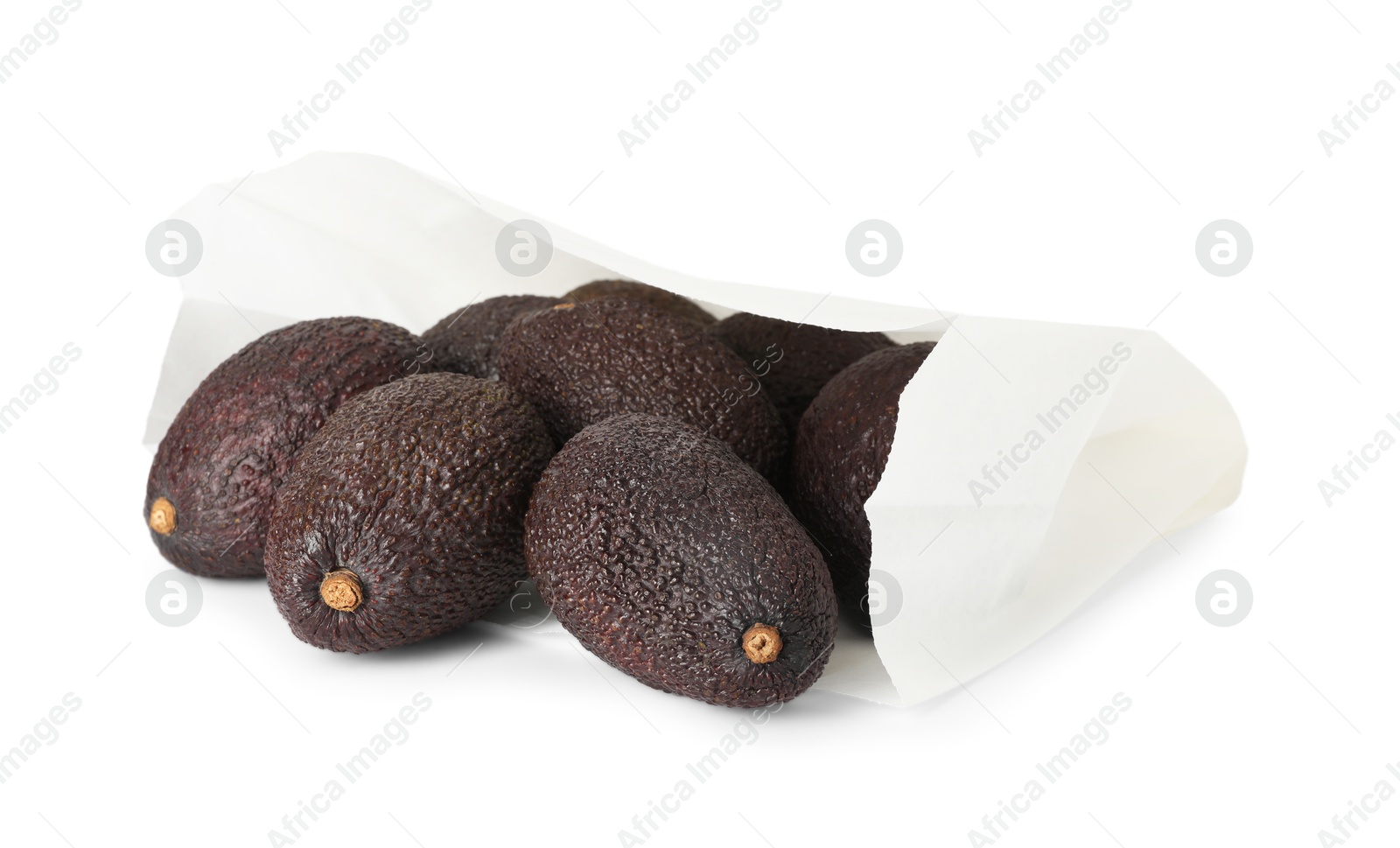 Photo of Ripe avocado fruits in paper package isolated on white