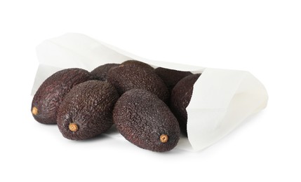Photo of Ripe avocado fruits in paper package isolated on white