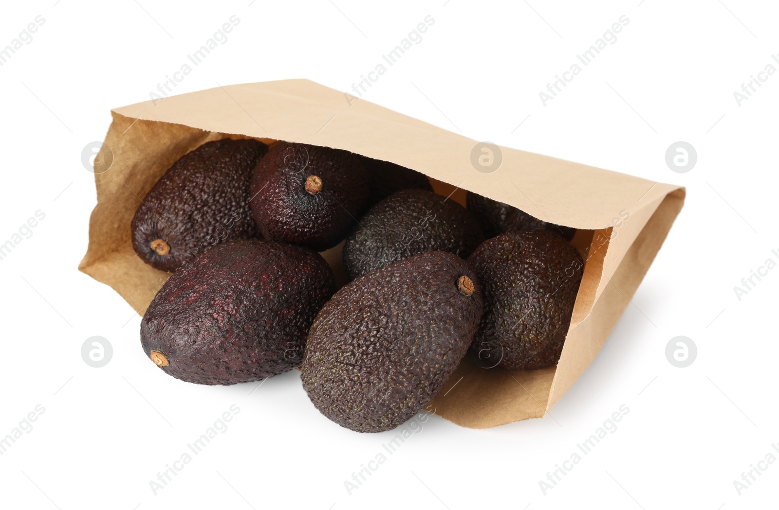Ripe avocado fruits in paper package isolated on white Photo of Ripe avocado fruits in paper package isolated on white