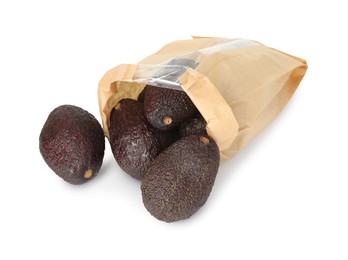 Photo of Ripe avocado fruits in paper package isolated on white