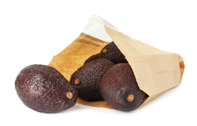 Photo of Ripe avocado fruits in paper package isolated on white