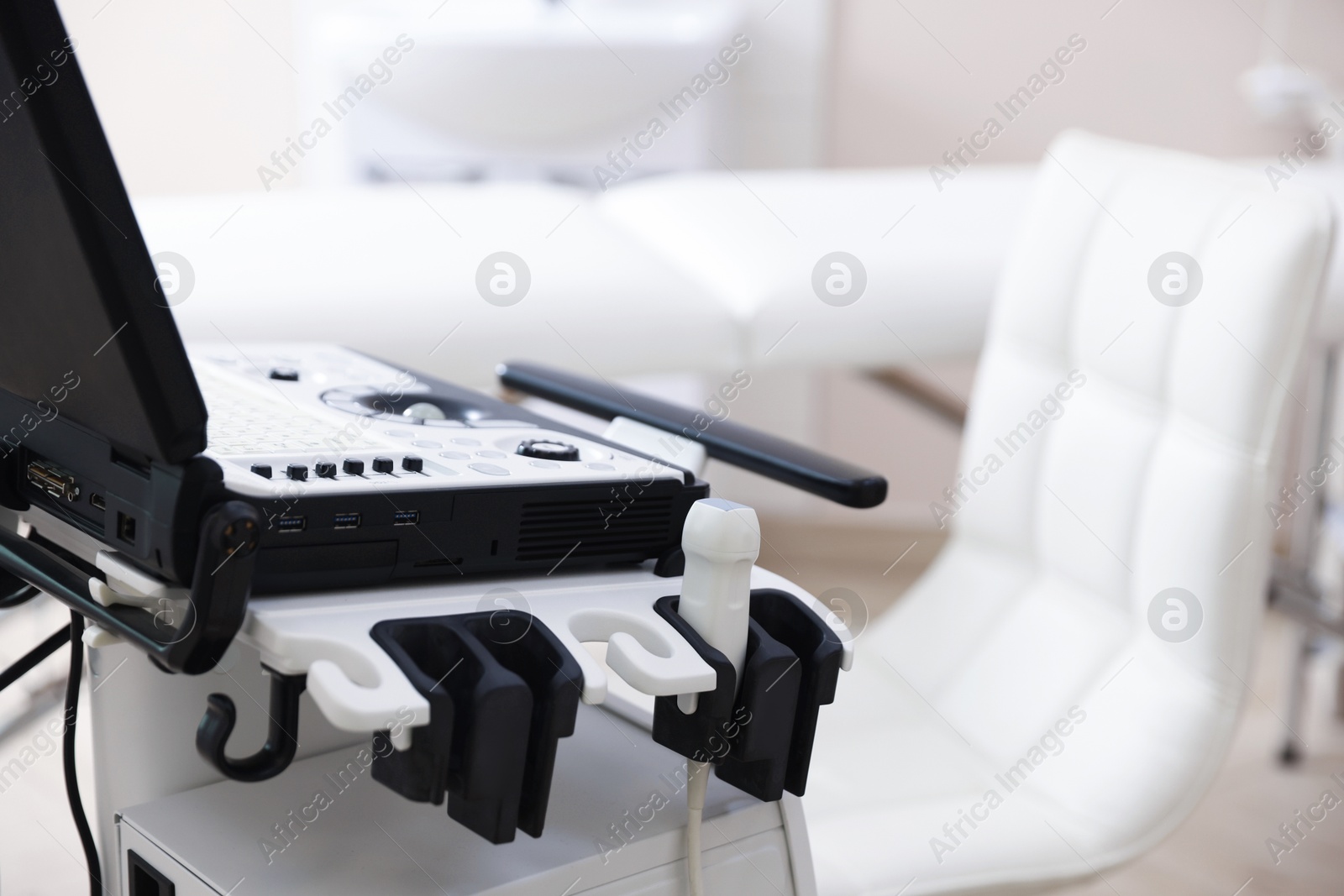 Modern ultrasound machine in clinic, closeup. Medical equipment Photo of Modern ultrasound machine in clinic, closeup. Medical equipment