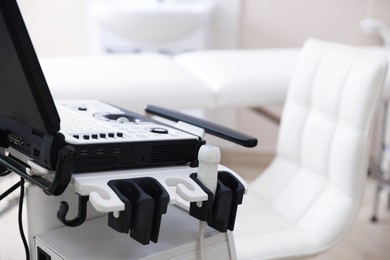 Photo of Modern ultrasound machine in clinic, closeup. Medical equipment