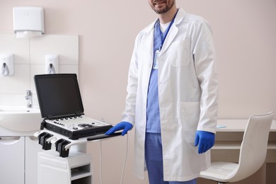Photo of Professional sonographer with ultrasound machine in clinic, closeup