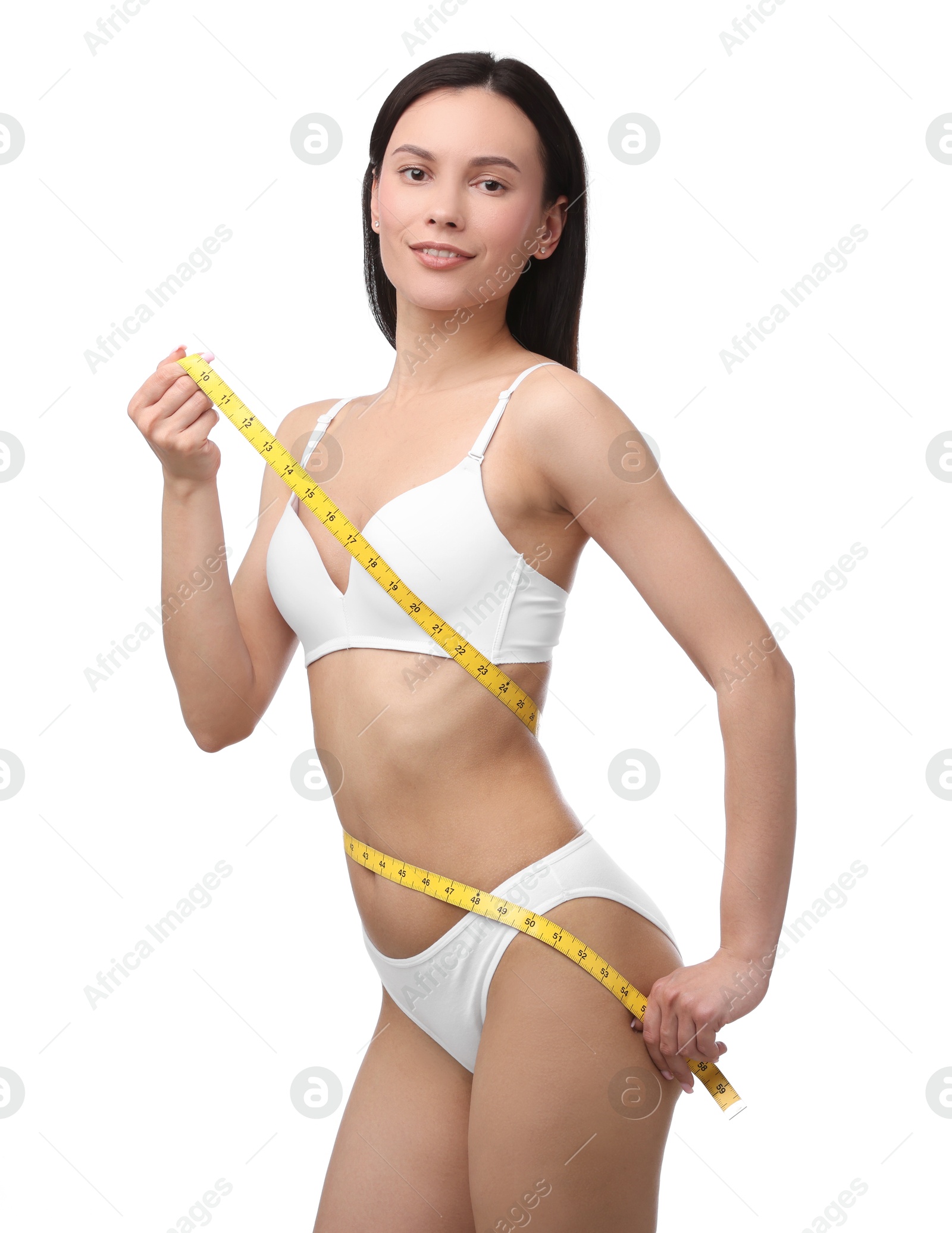 Woman with slim body and measuring tape on white background Photo of Woman with slim body and measuring tape on white background