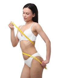 Photo of Woman with slim body and measuring tape on white background