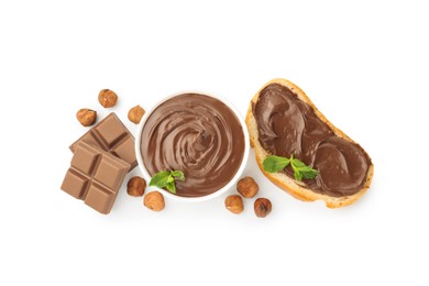 Photo of Tasty chocolate spread with mint in bowl, toast and hazelnuts isolated on white, top view
