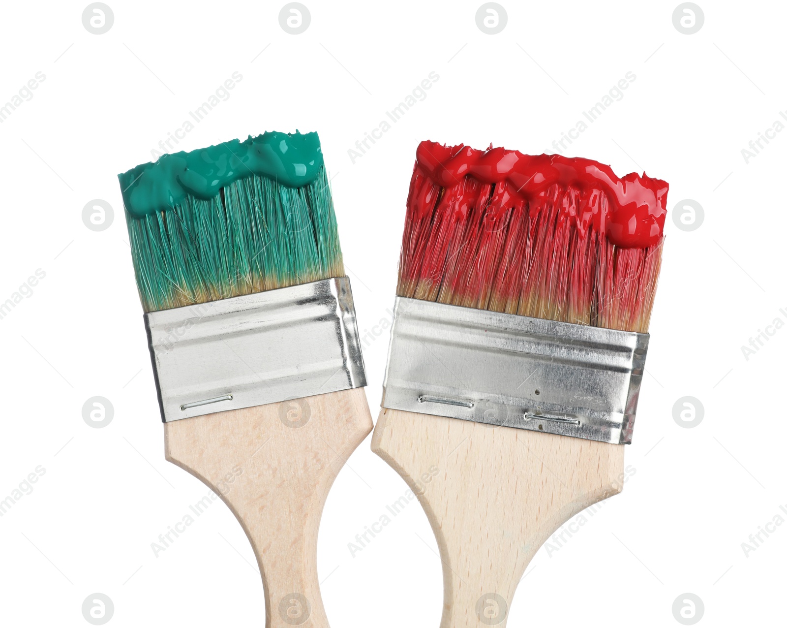 Brushes with green and red paints isolated on white Photo of Brushes with green and red paints isolated on white