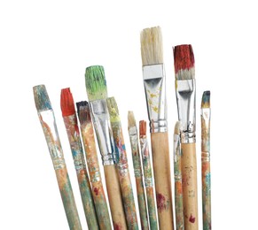 Photo of Brushes with different paints isolated on white