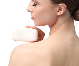 Photo of Beautiful woman with soap bar on white background, closeup