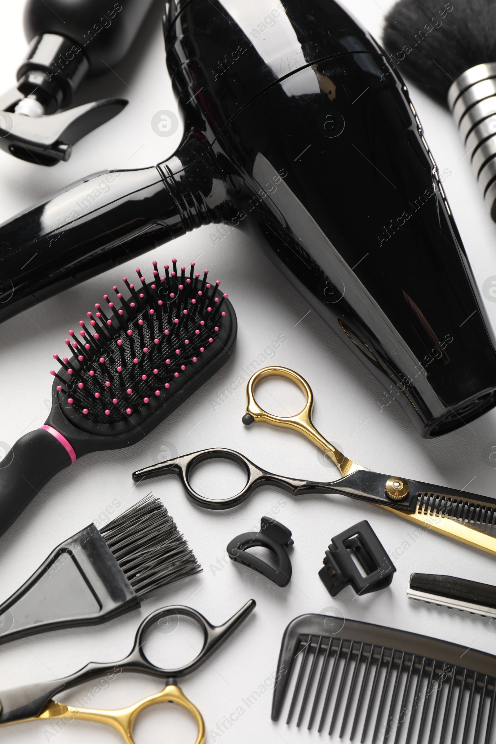 Different hairdresser's tools on light grey background, above view Photo of Different hairdresser's tools on light grey background, above view