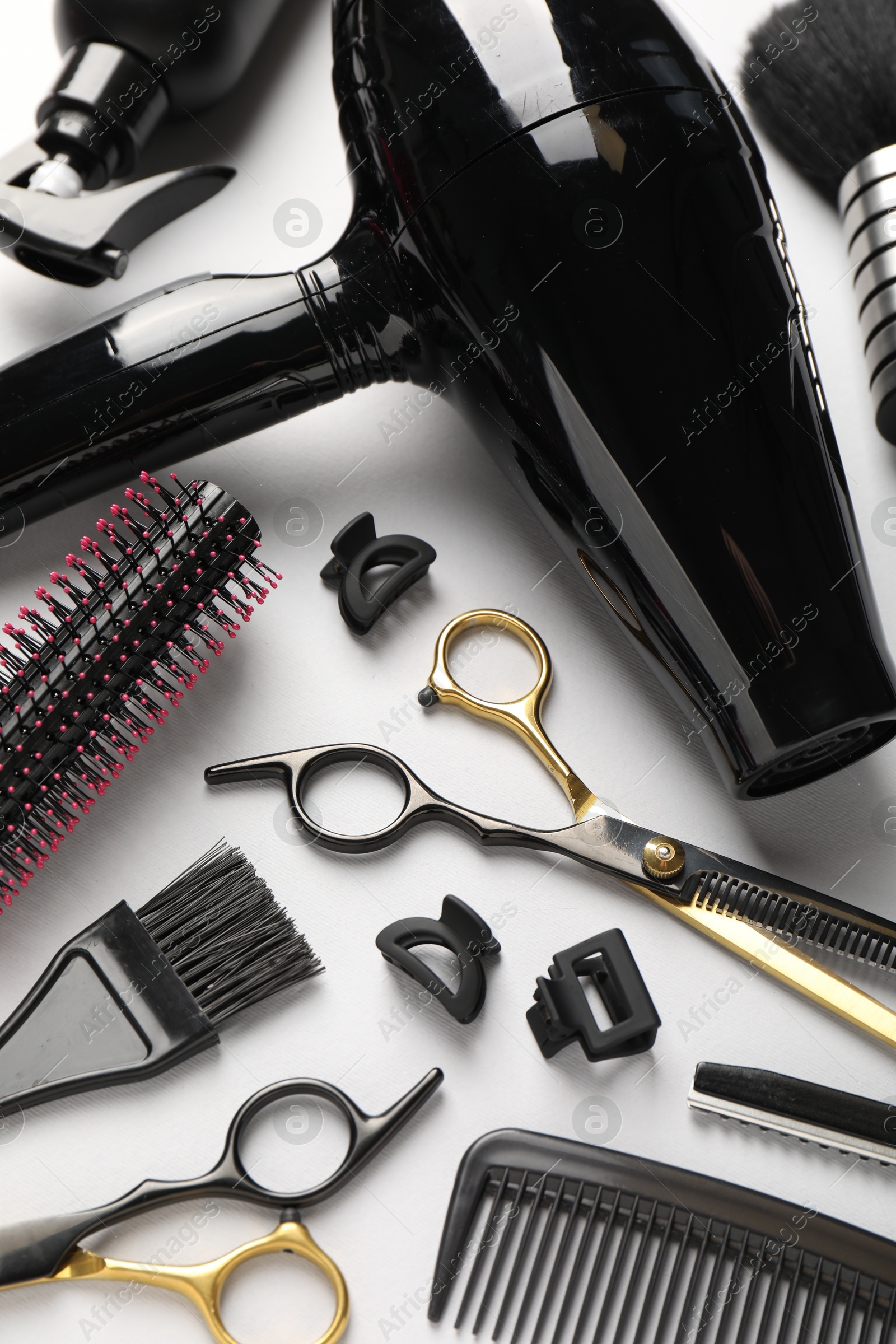 Different hairdresser's tools on light grey background, above view Photo of Different hairdresser's tools on light grey background, above view