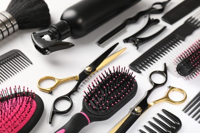 Photo of Different hairdresser's tools on light grey background