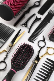 Photo of Different hairdresser's tools on light grey background, above view