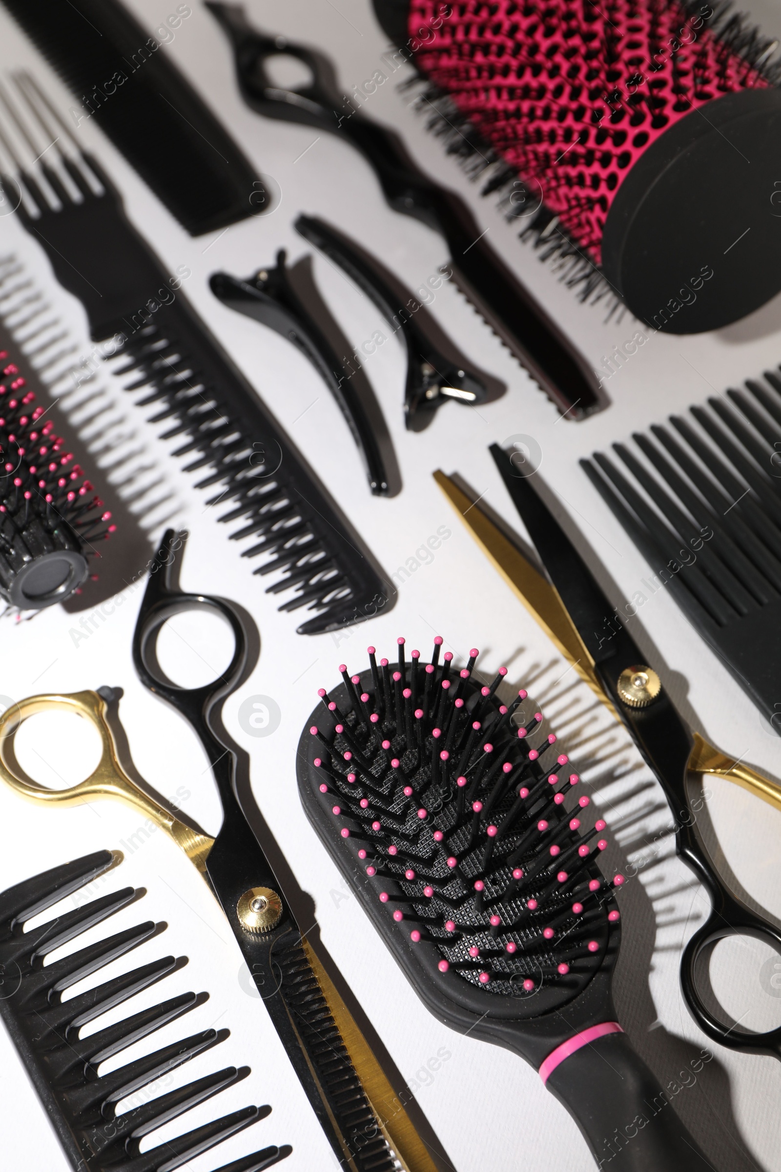 Different hairdresser's tools on light grey background, above view Photo of Different hairdresser's tools on light grey background, above view