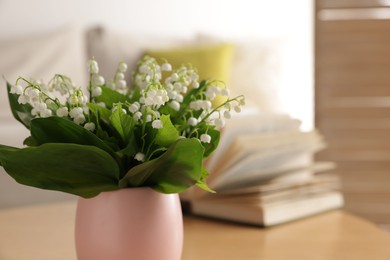 Photo of Bouquet of beautiful lily-of-the-valley at home, closeup