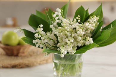 Photo of Bouquet of beautiful lily-of-the-valley at home, closeup