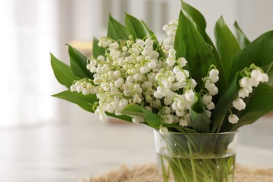 Photo of Bouquet of beautiful lily-of-the-valley at home, closeup