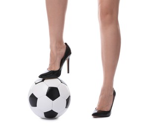 Photo of Woman in high heeled shoes with soccer ball on white background, closeup
