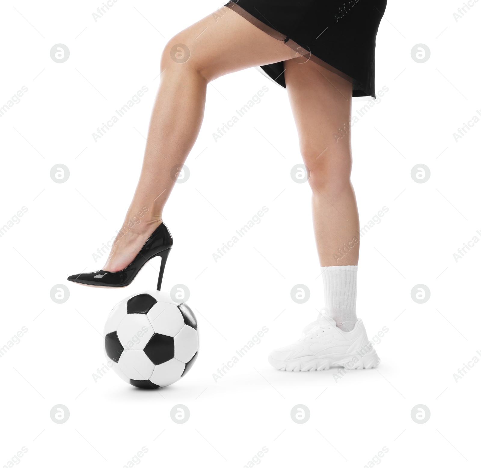 Photo of Woman in high heeled shoe and sneaker with soccer ball on white background, closeup