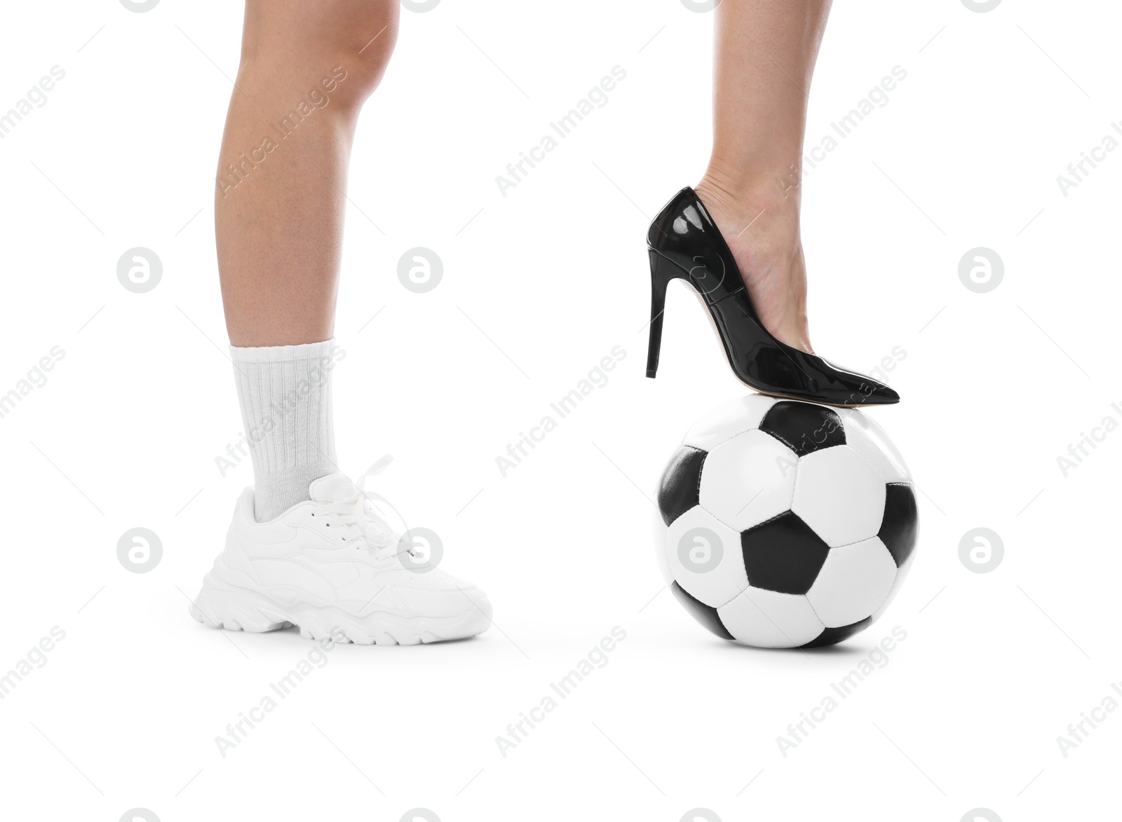 Photo of Woman in high heeled shoe and sneaker with soccer ball on white background, closeup