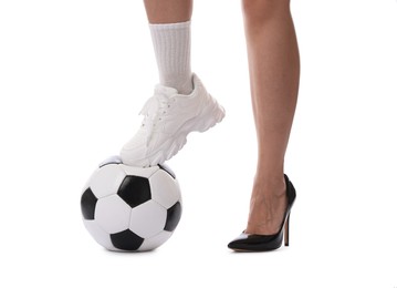 Photo of Woman in high heeled shoe and sneaker with soccer ball on white background, closeup